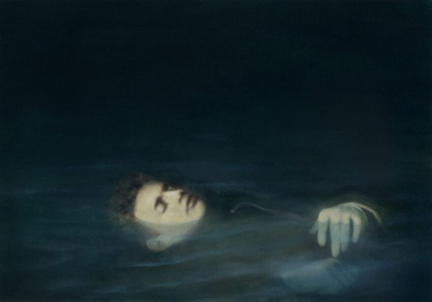 Man semi-submerged in water